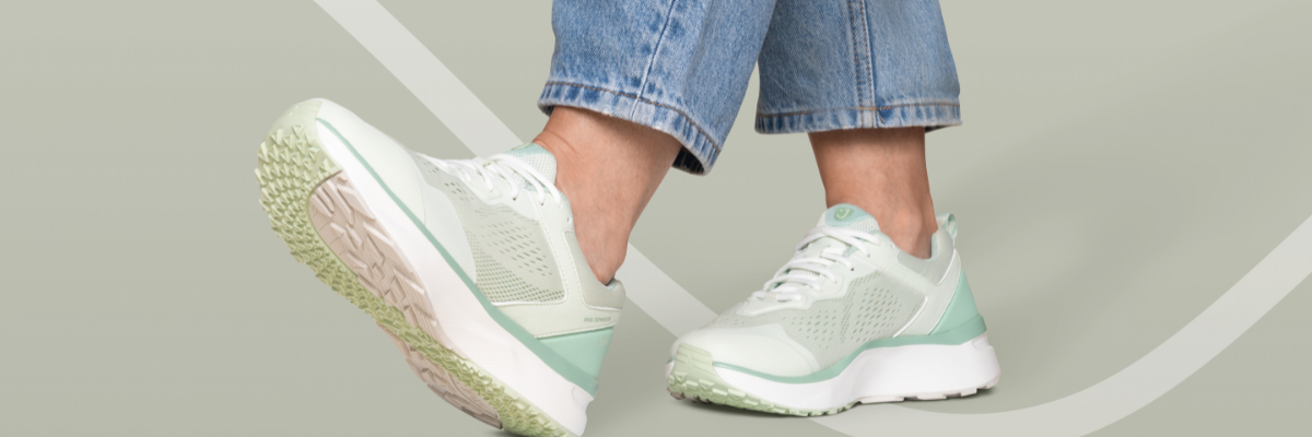 women wearing sneakers on green background