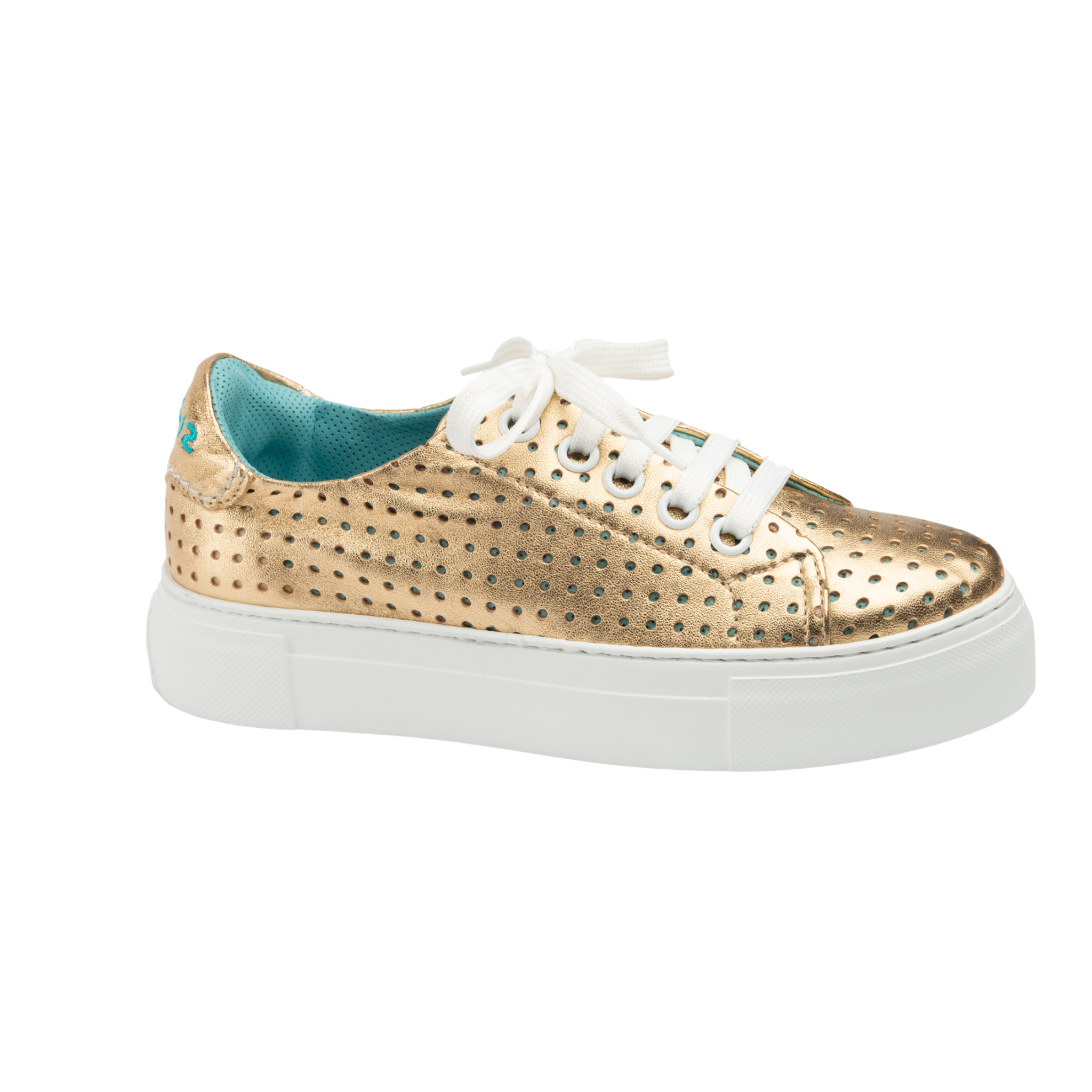 Gold perforated sneaker with white laces on a white background