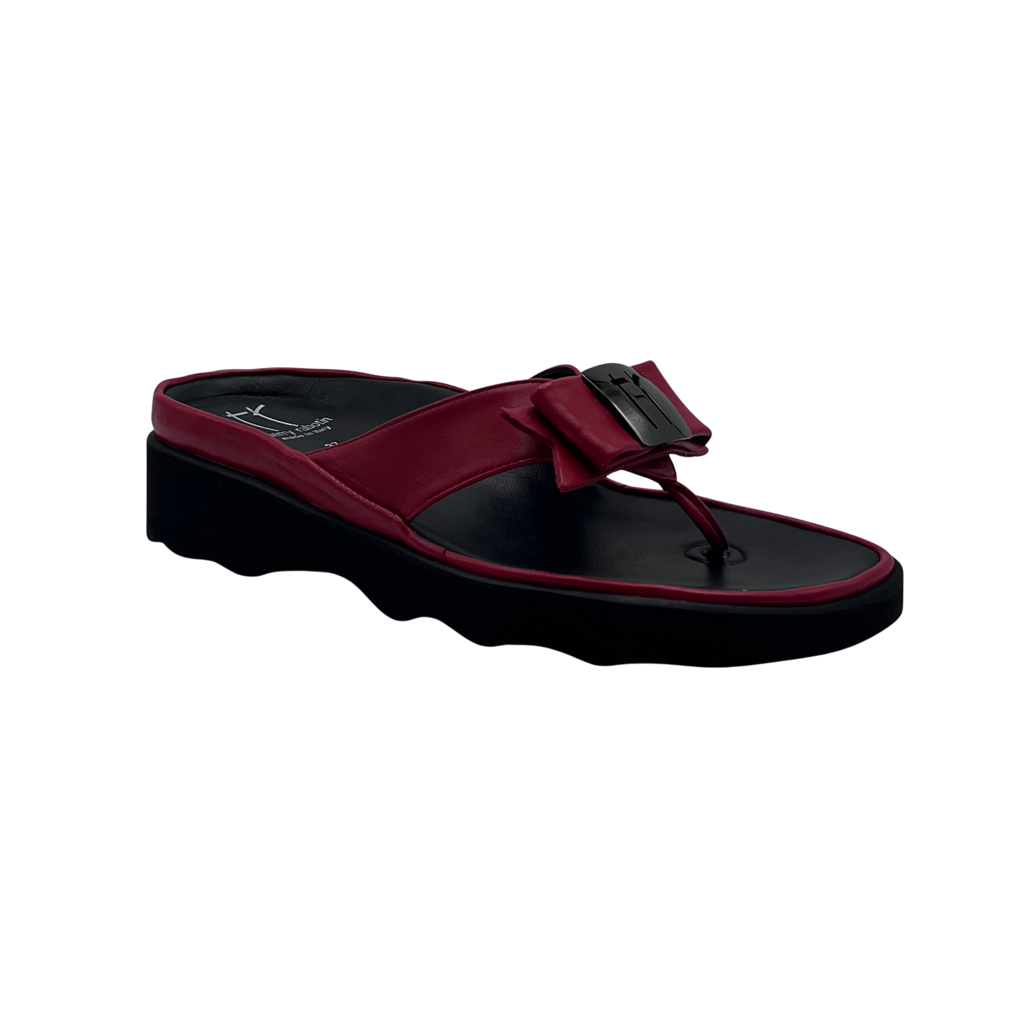 A single women's platform sandal in burgundy and black, featuring a wide bow detail on the strap with a small metallic accent, set against a plain white background.