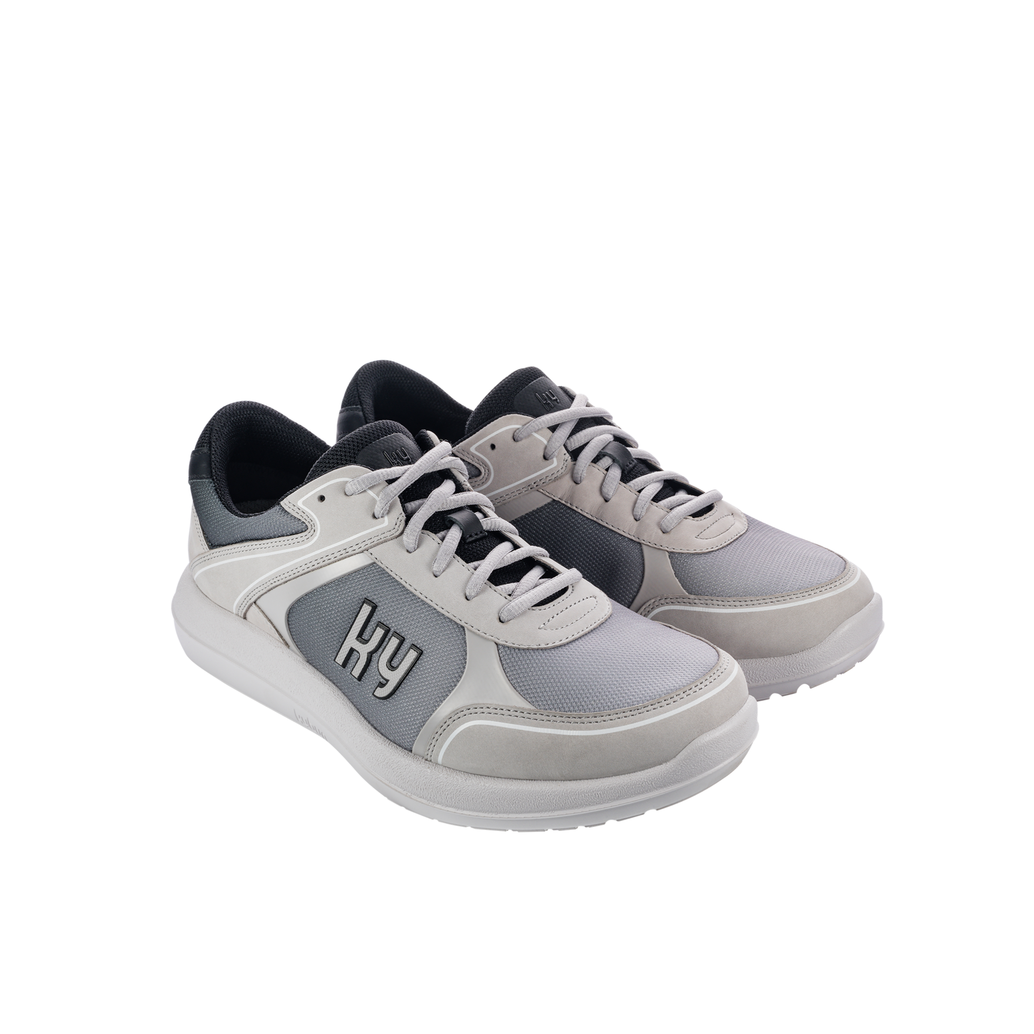 Gray sneakers with black accents on a white background