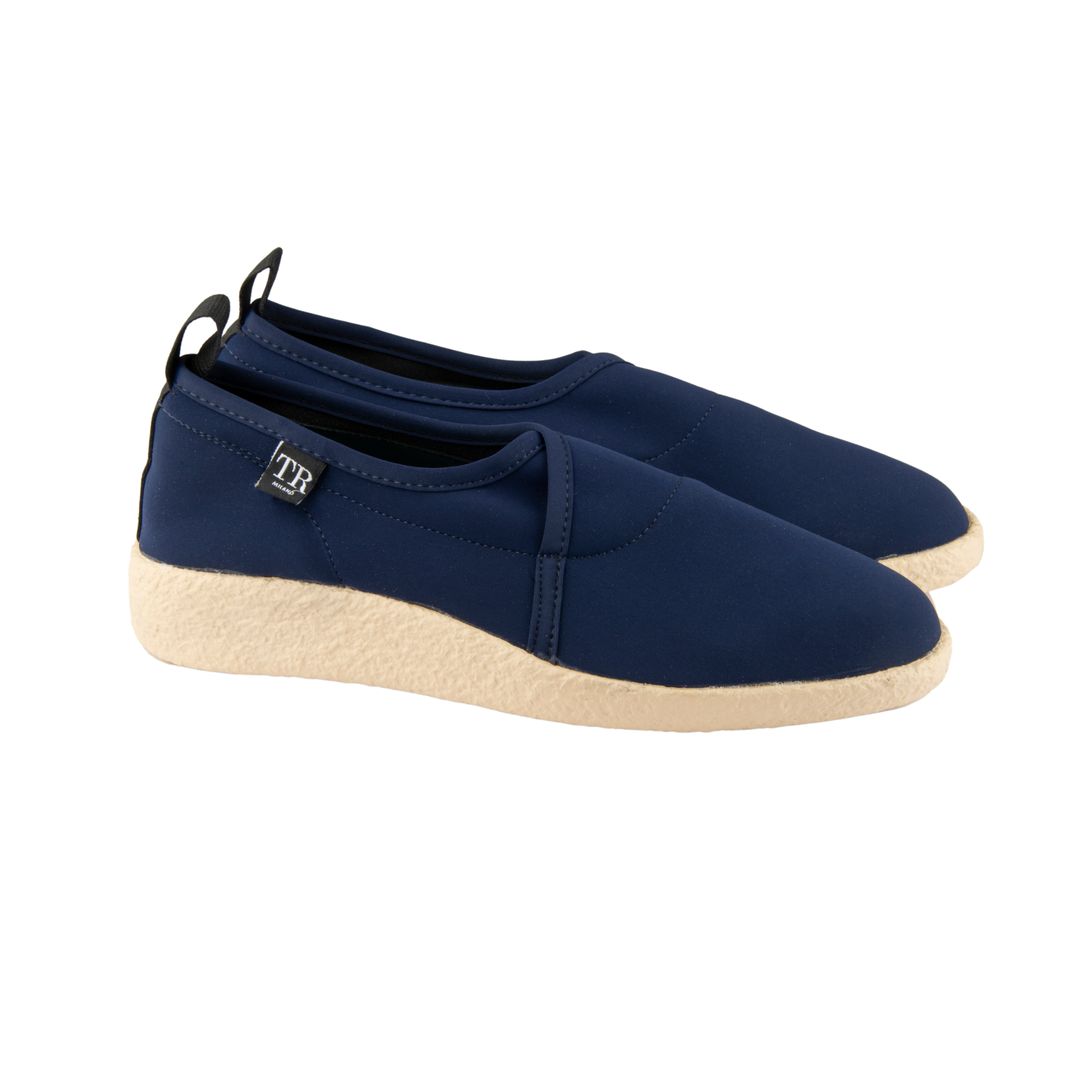 Pair of navy blue shoes with beige soles on a white background