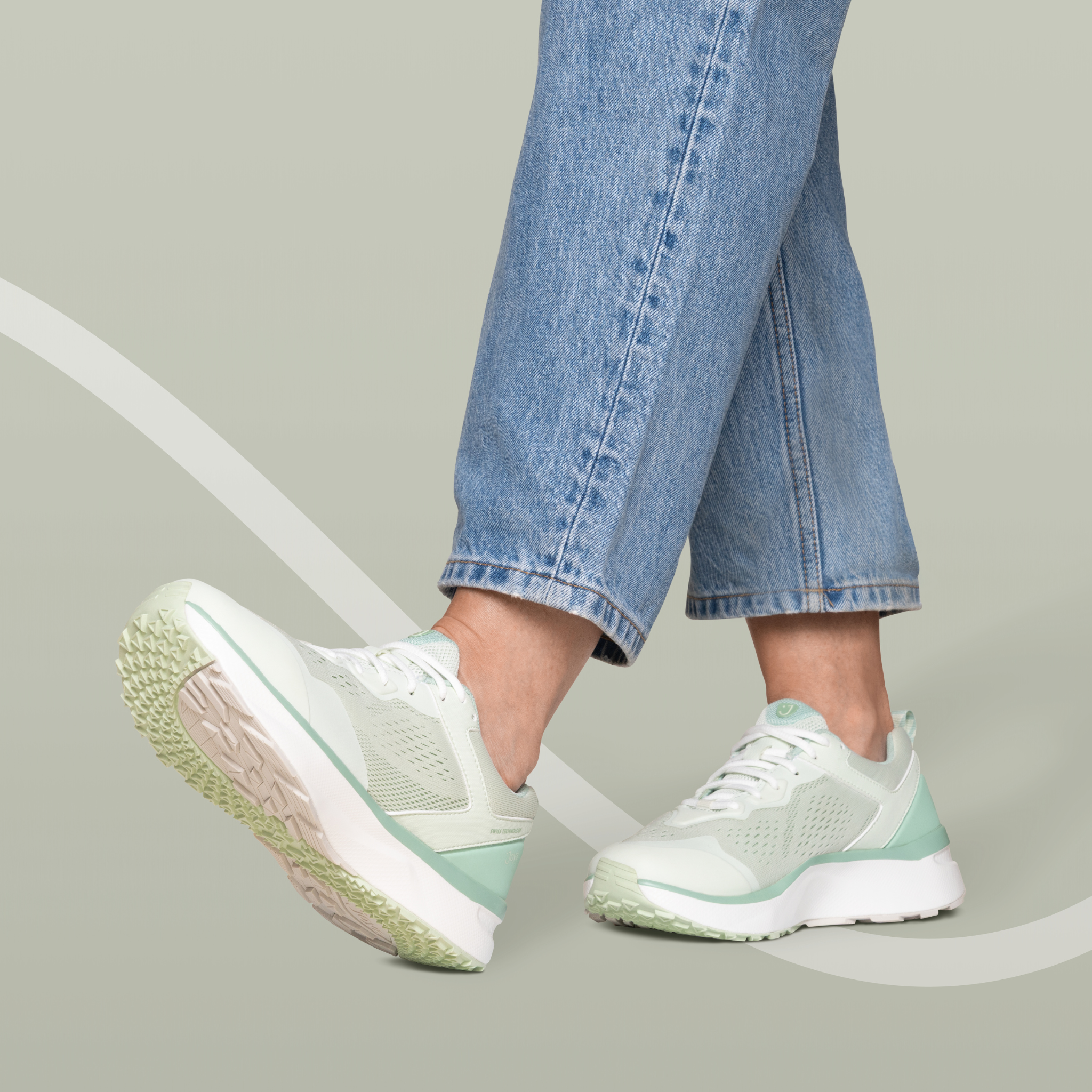 women in blue jean wearing sneakers