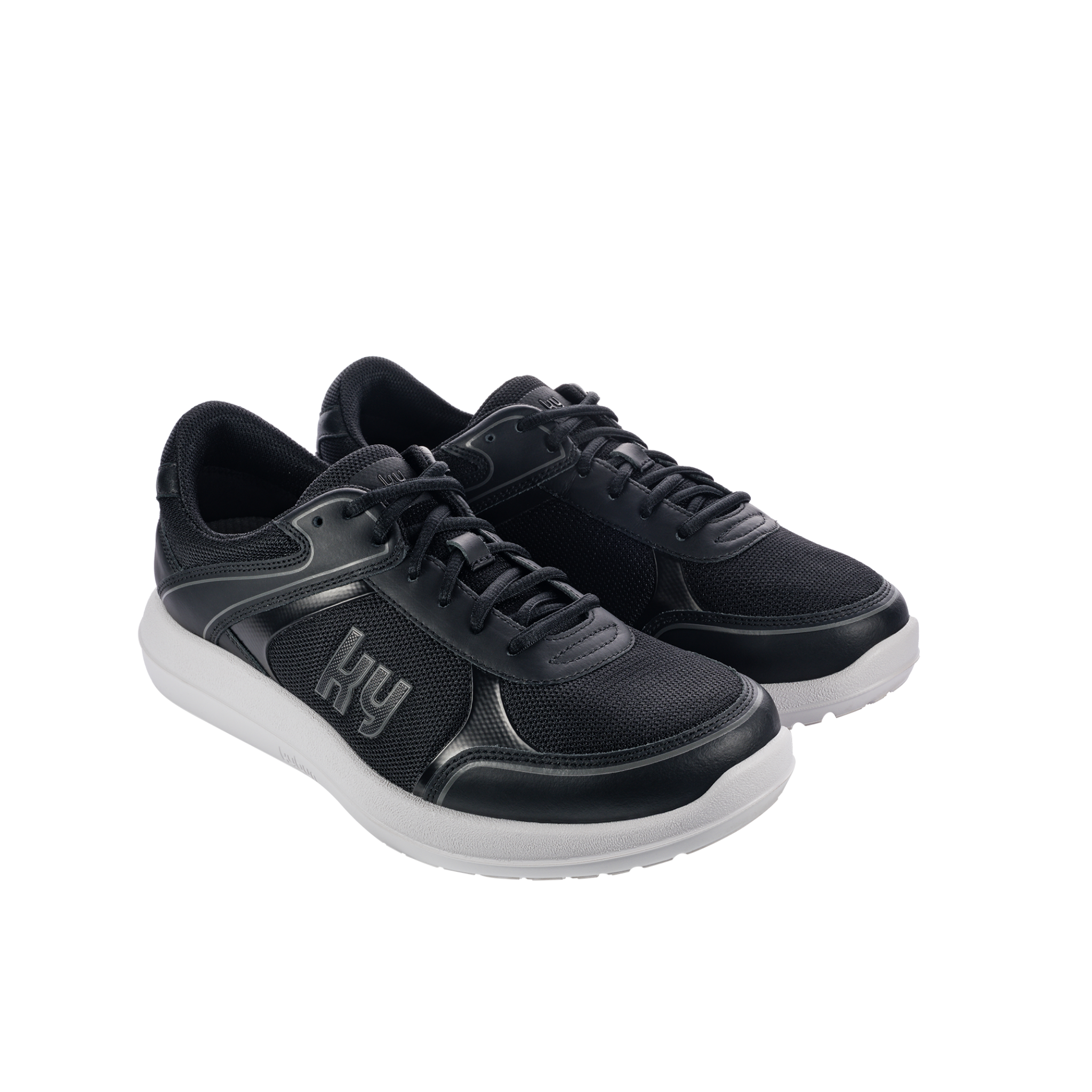 Black sneakers with white soles on a white background