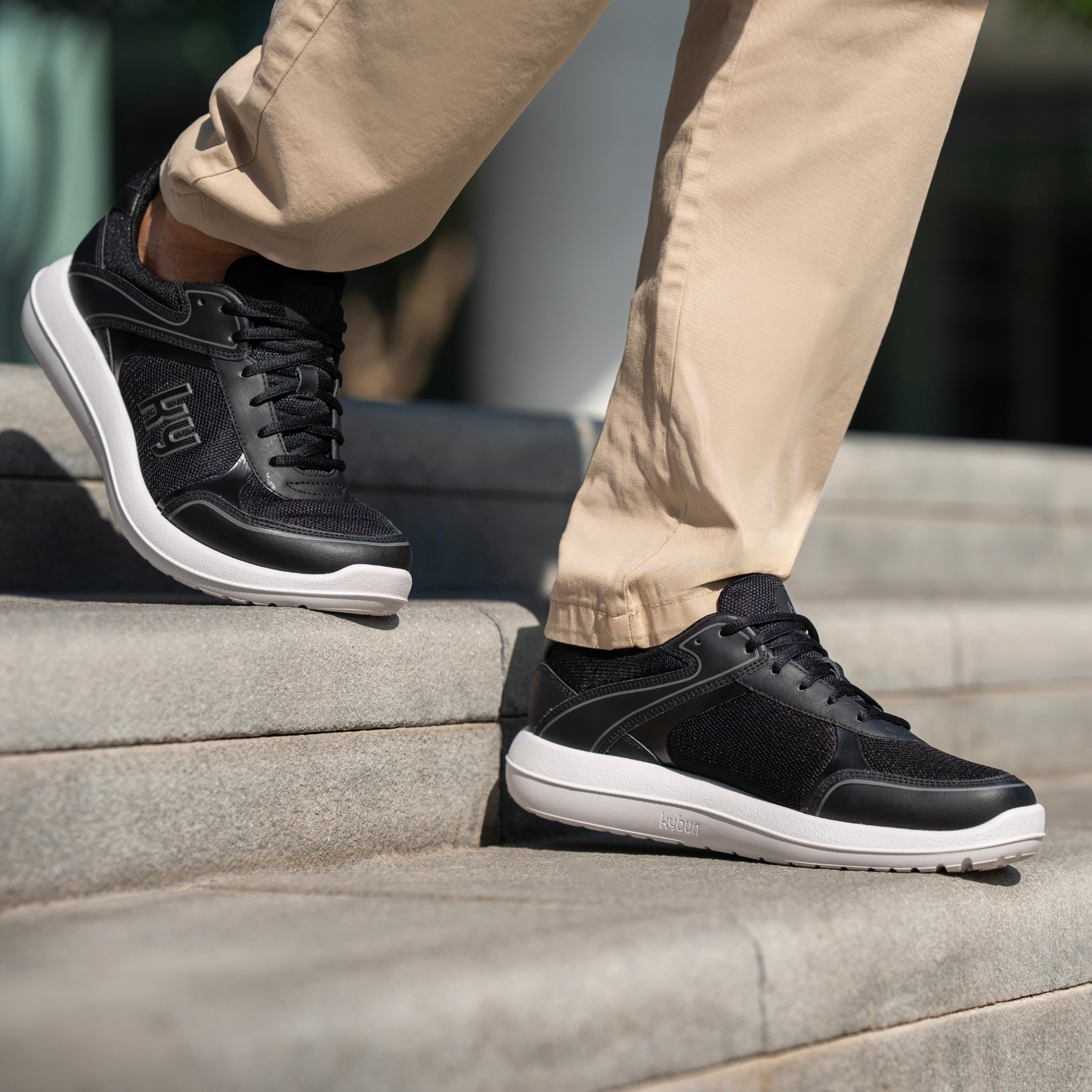 man wearing black and white sneaker