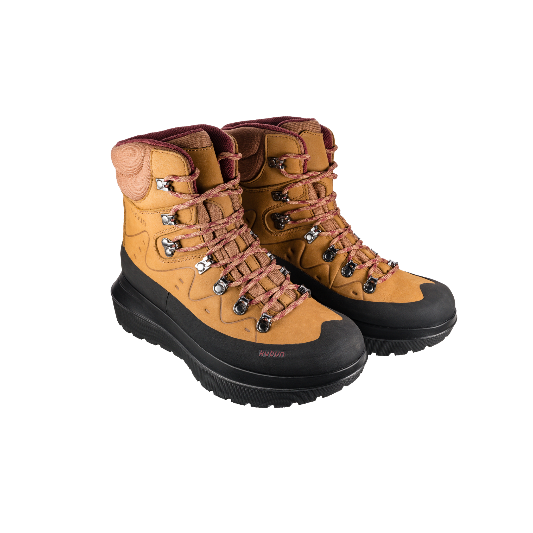 Pair of tan hiking boots with black soles on a white background