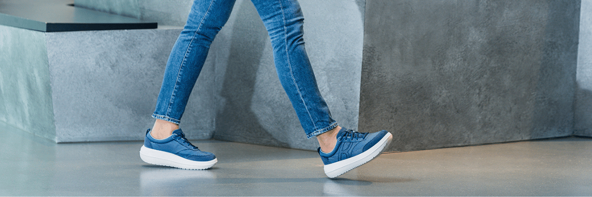 women walking wearing blue kybun shoes