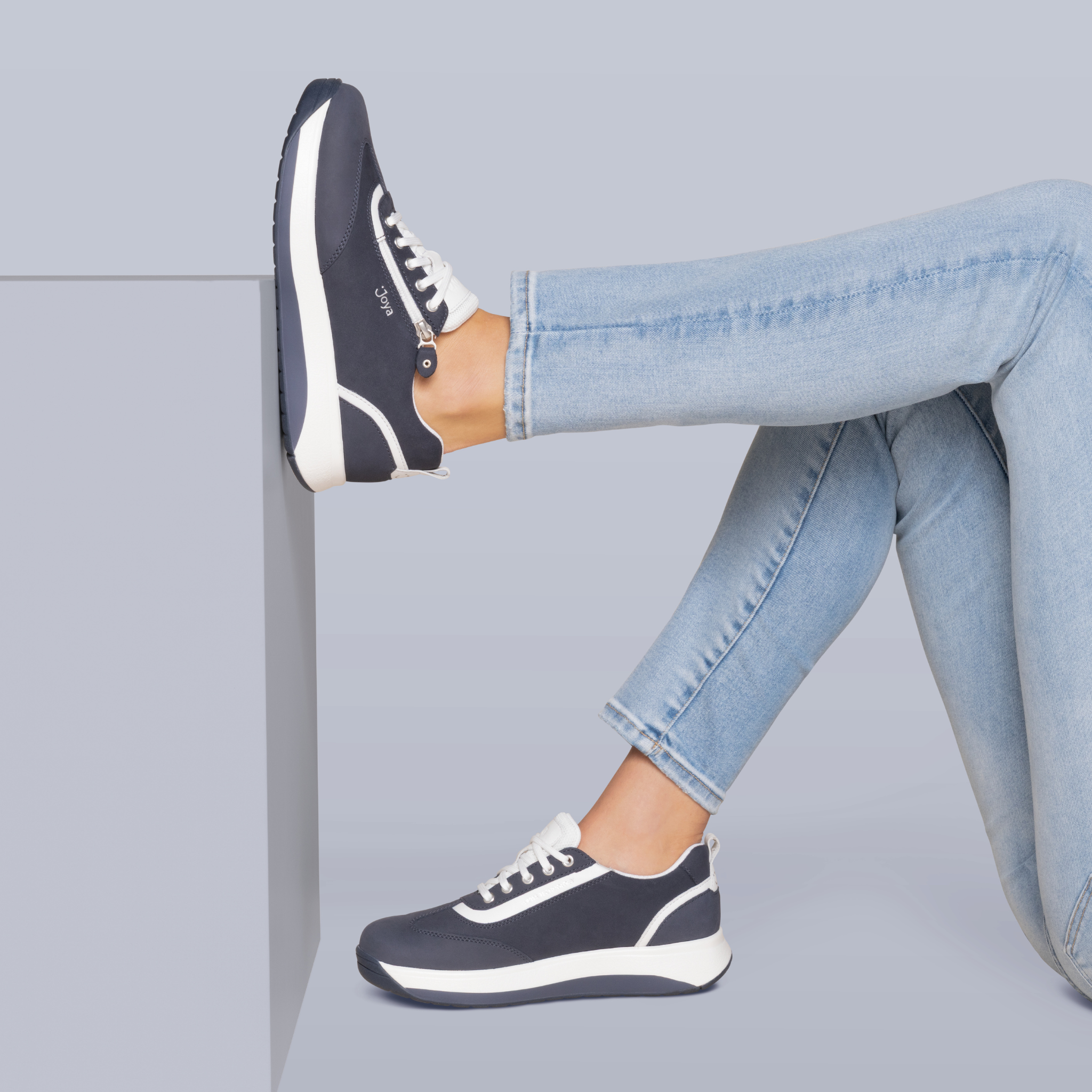 women wearing jeans blue sneakers