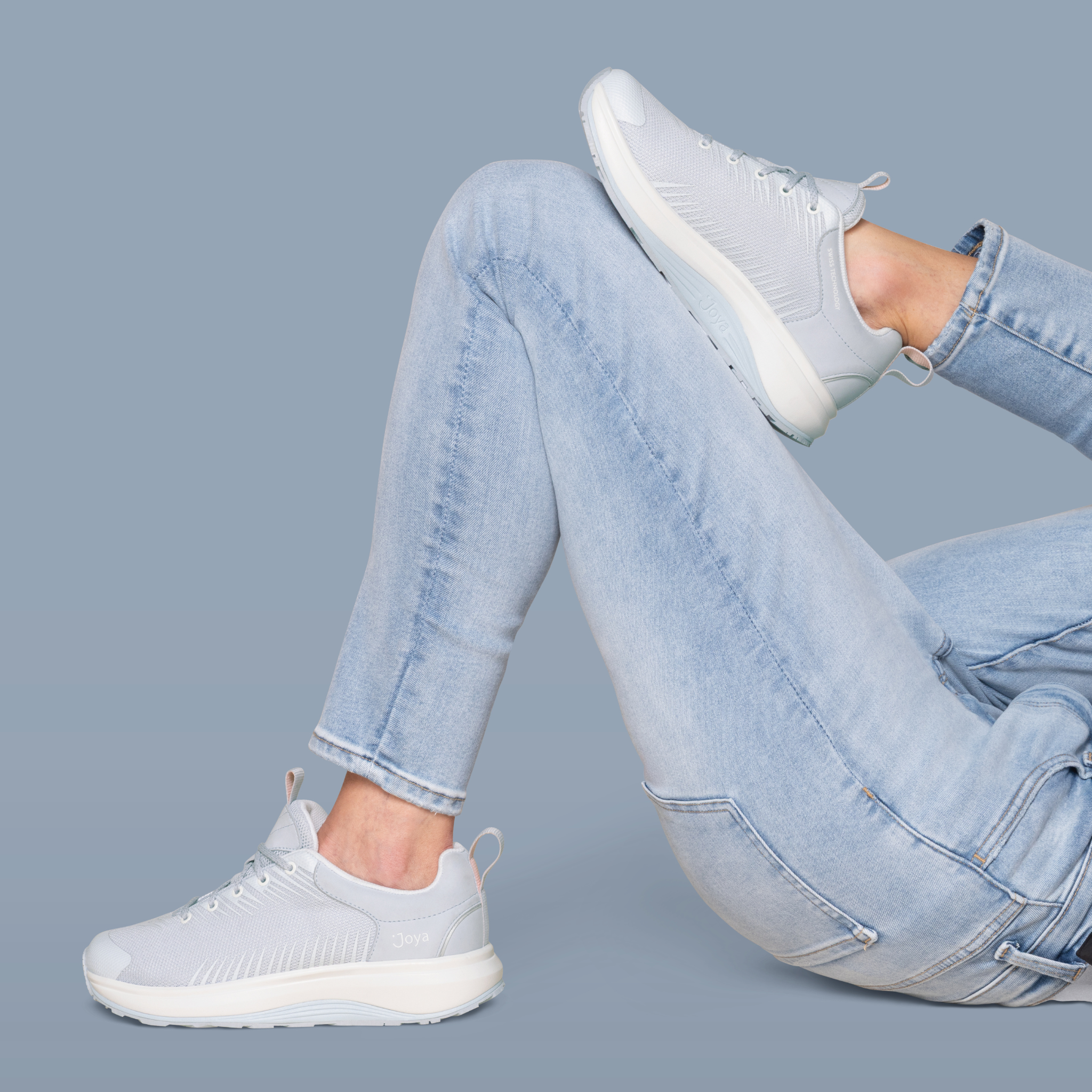 women wearing light blue sneaker on a blue background