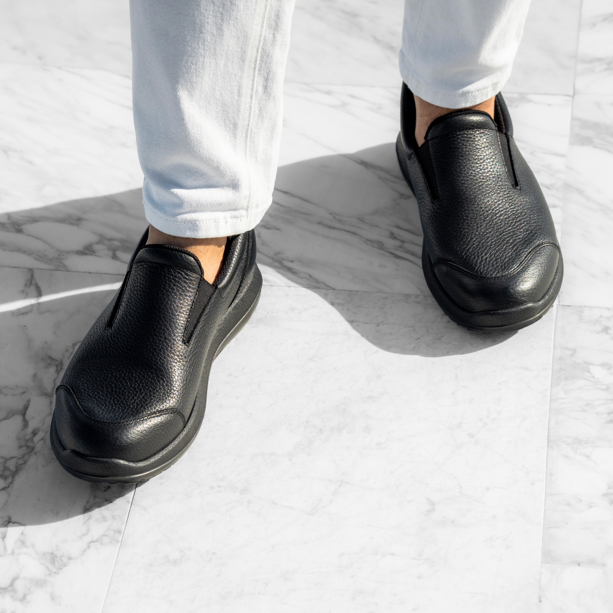 men wearing black shoes on white background
