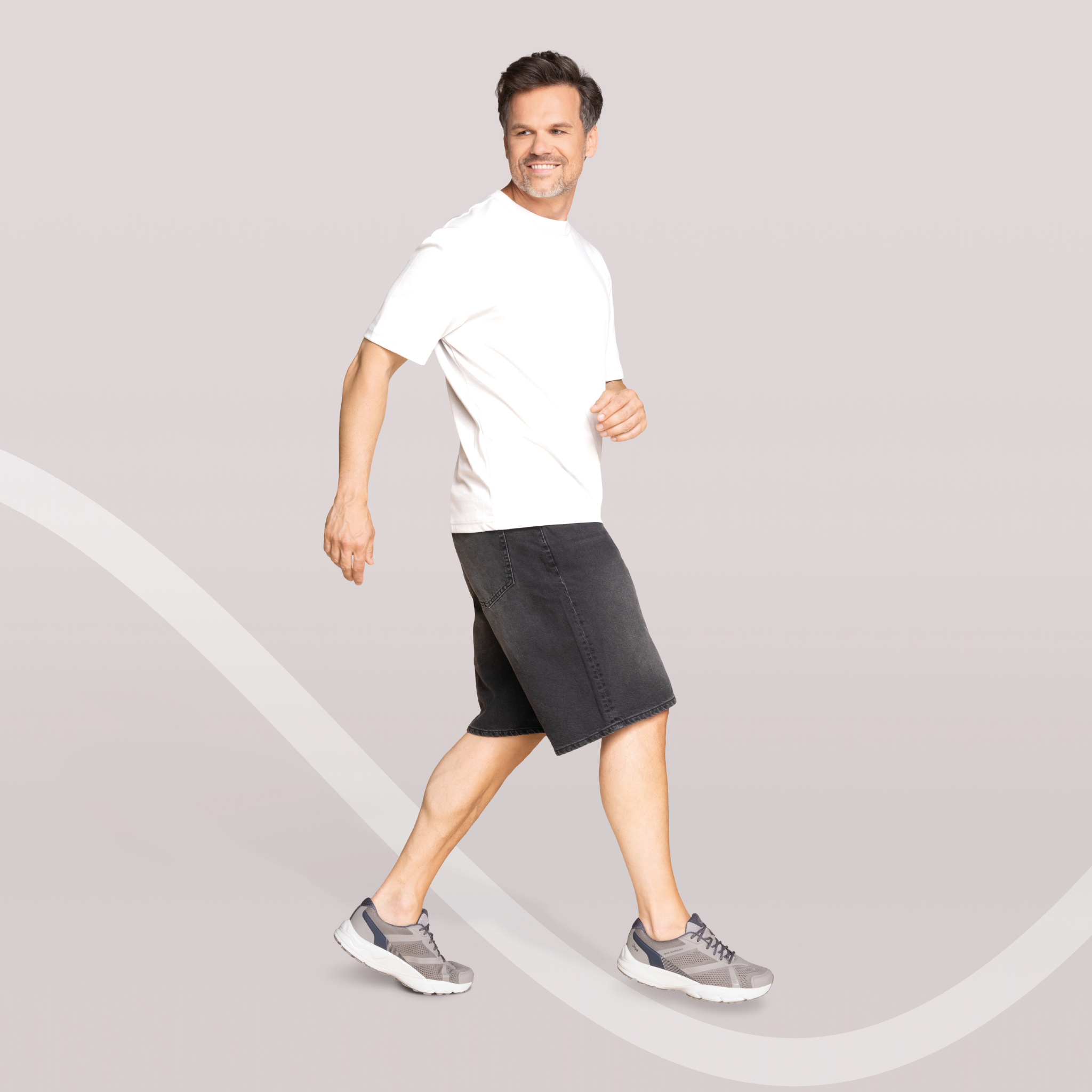 man wearing Joya Men's Nova Grey Shoe on grey background