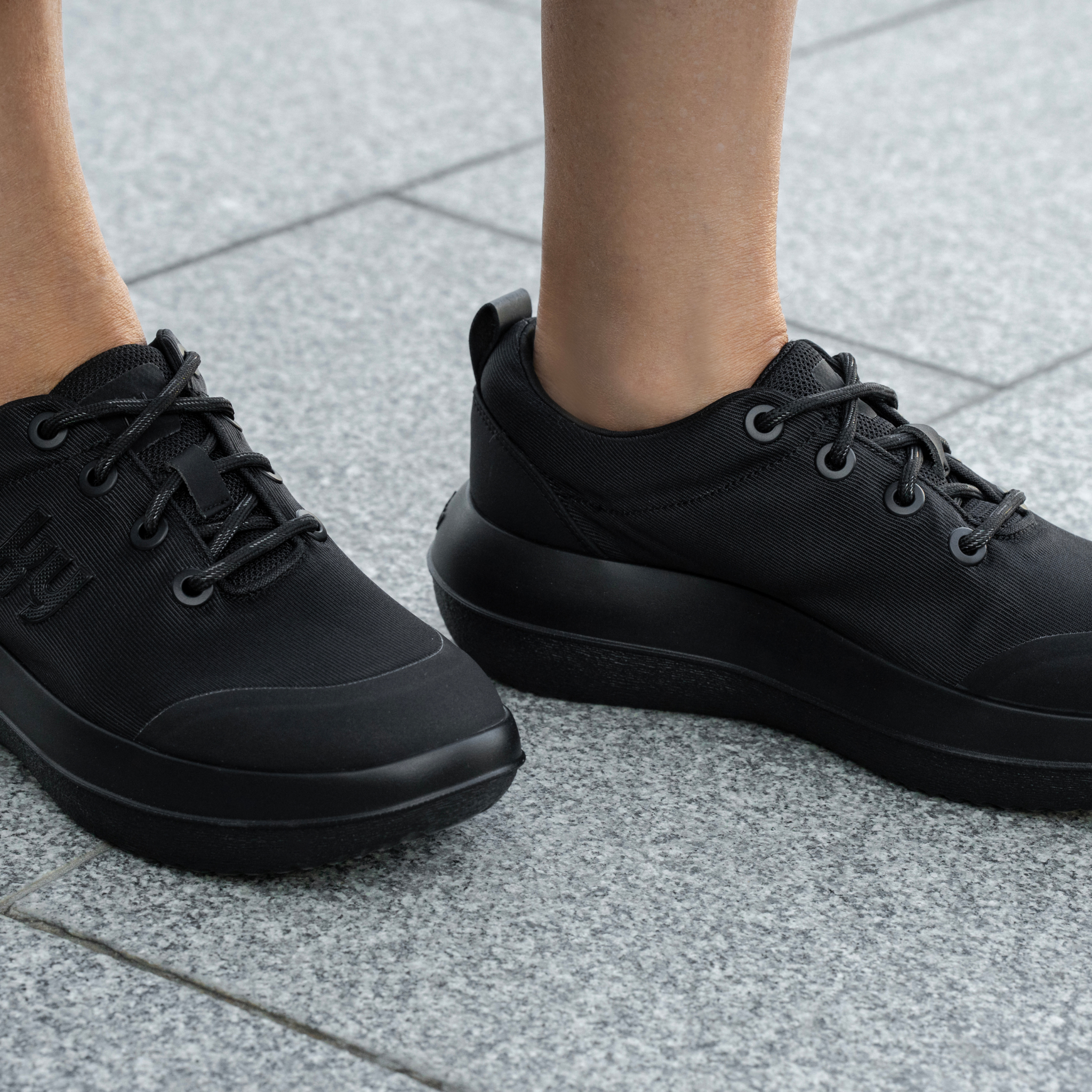 close up shot of kybun Women's Pura Black Shoe on a women