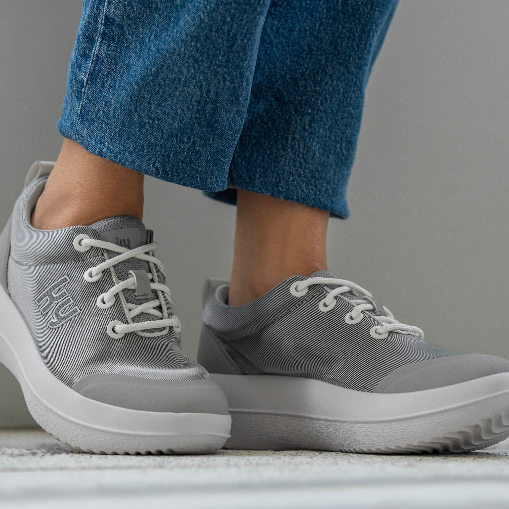 women wearing blue jeans and kybun Women's Pura Silver Shoe